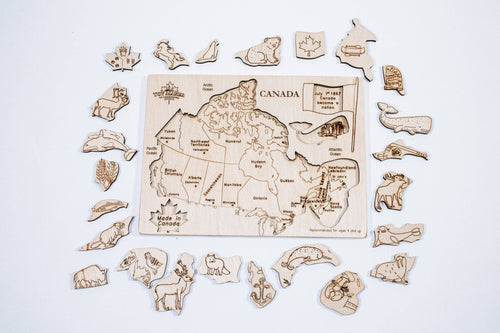 Wooden Canada map puzzle with native animal pieces