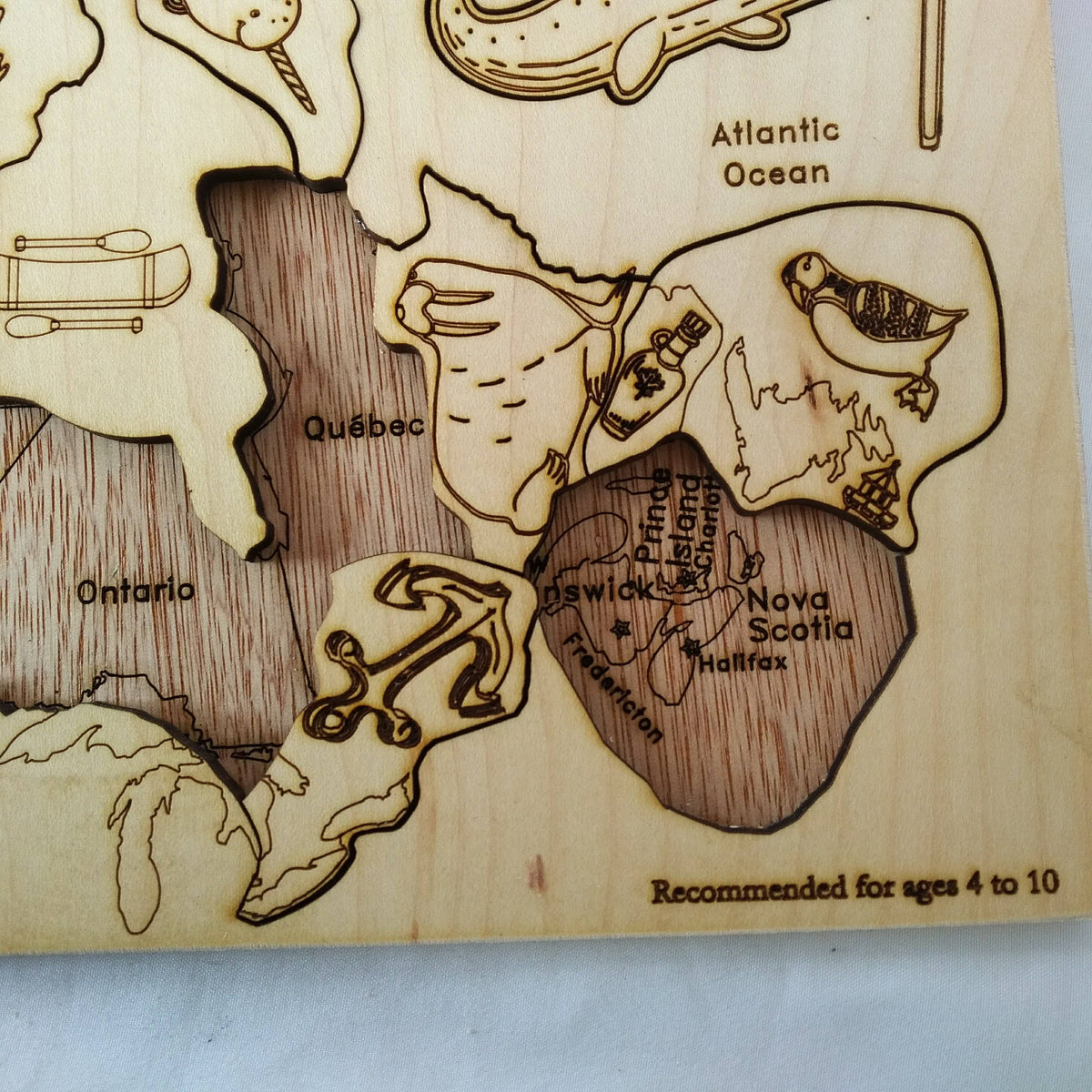 Wooden Canada map puzzle with native animal pieces, photo 4